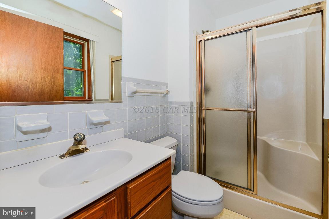 241 Windjammer Road Berlin, MD 21811 - Photo 26 of 38 a bathroom with a sink toilet and shower
