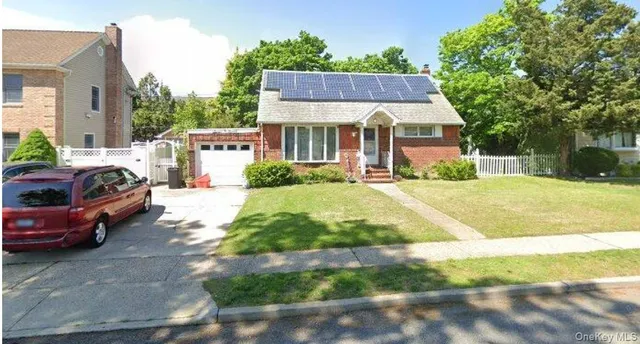 a living room with furniture and a lamp