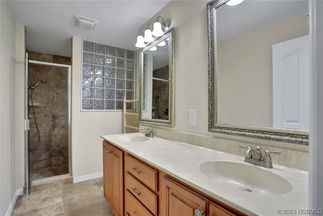 an empty room with a chandelier fan