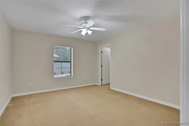 a view of an house with backyard space and garden