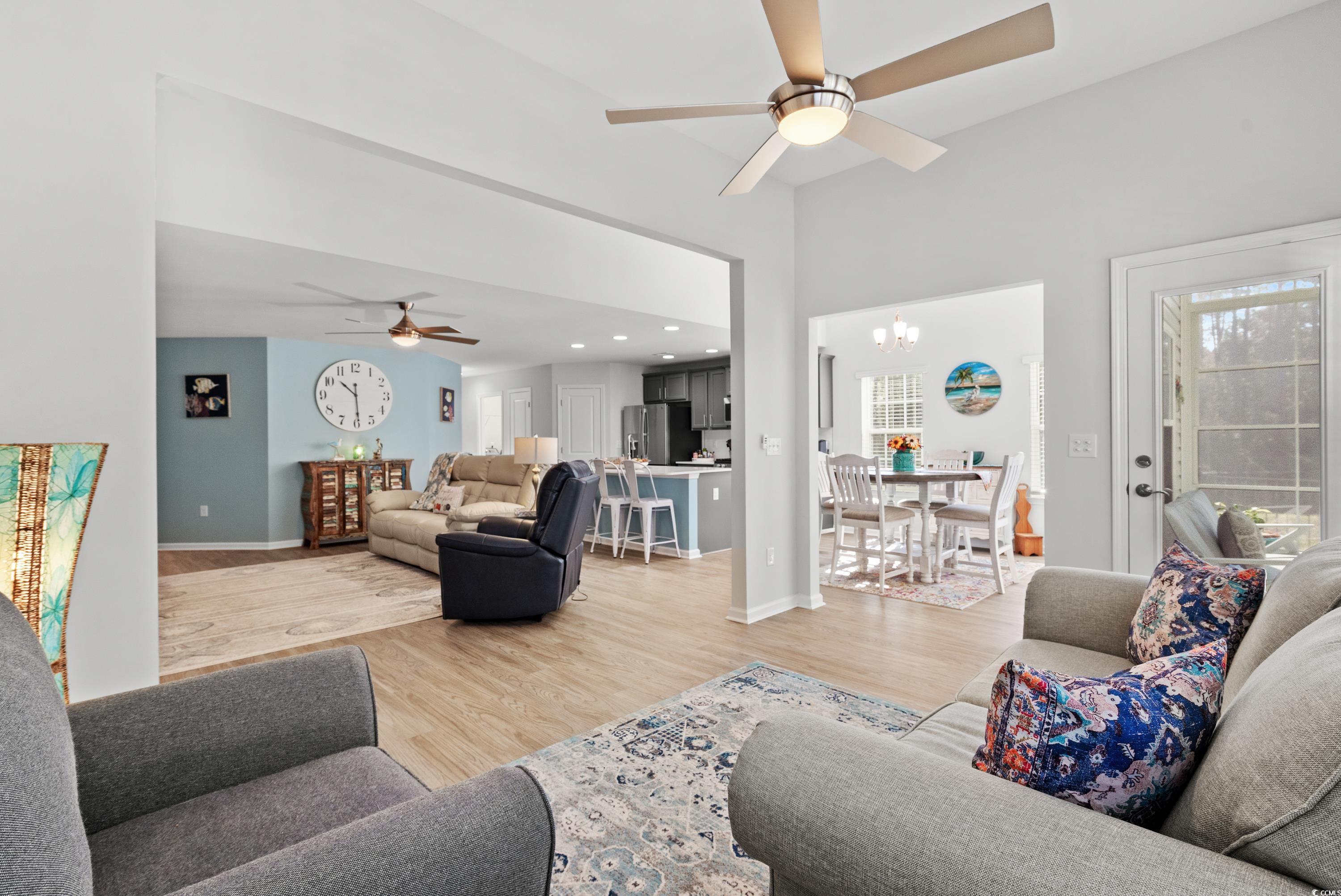 968 Cypress Way Little River, SC 29566 - Photo 18 of 40 Living room featuring lofted ceiling, wood-type fl