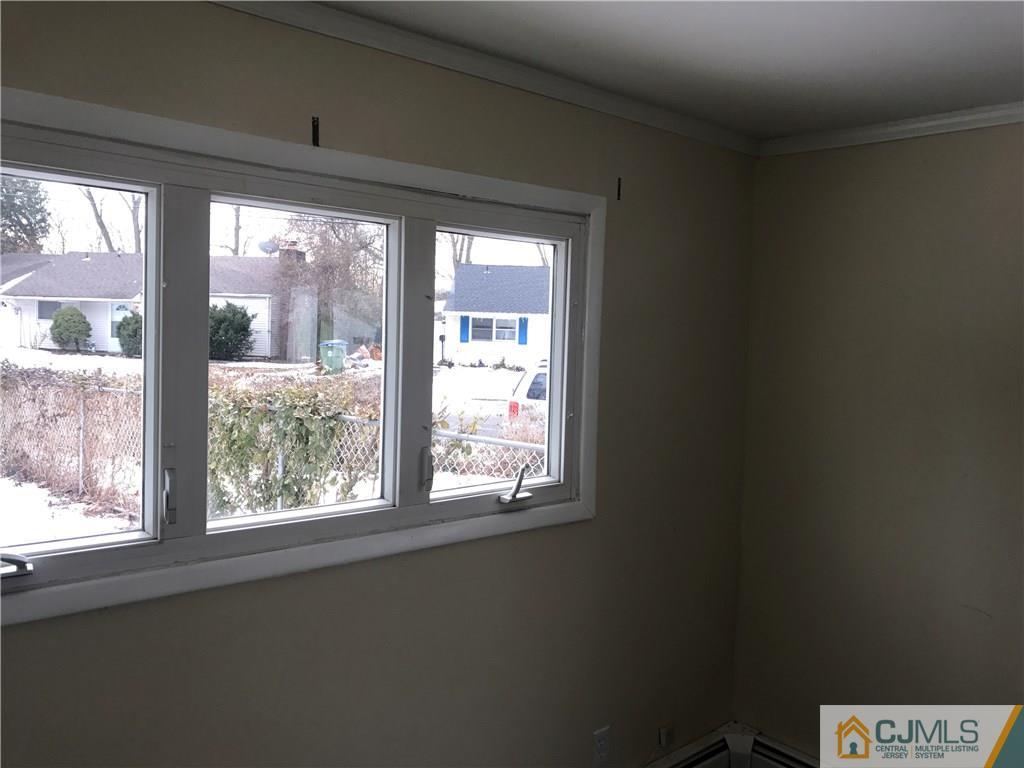 47 Kenmore Road Edison, NJ 08817 - Photo 3 of 14 a view of an empty room with a window