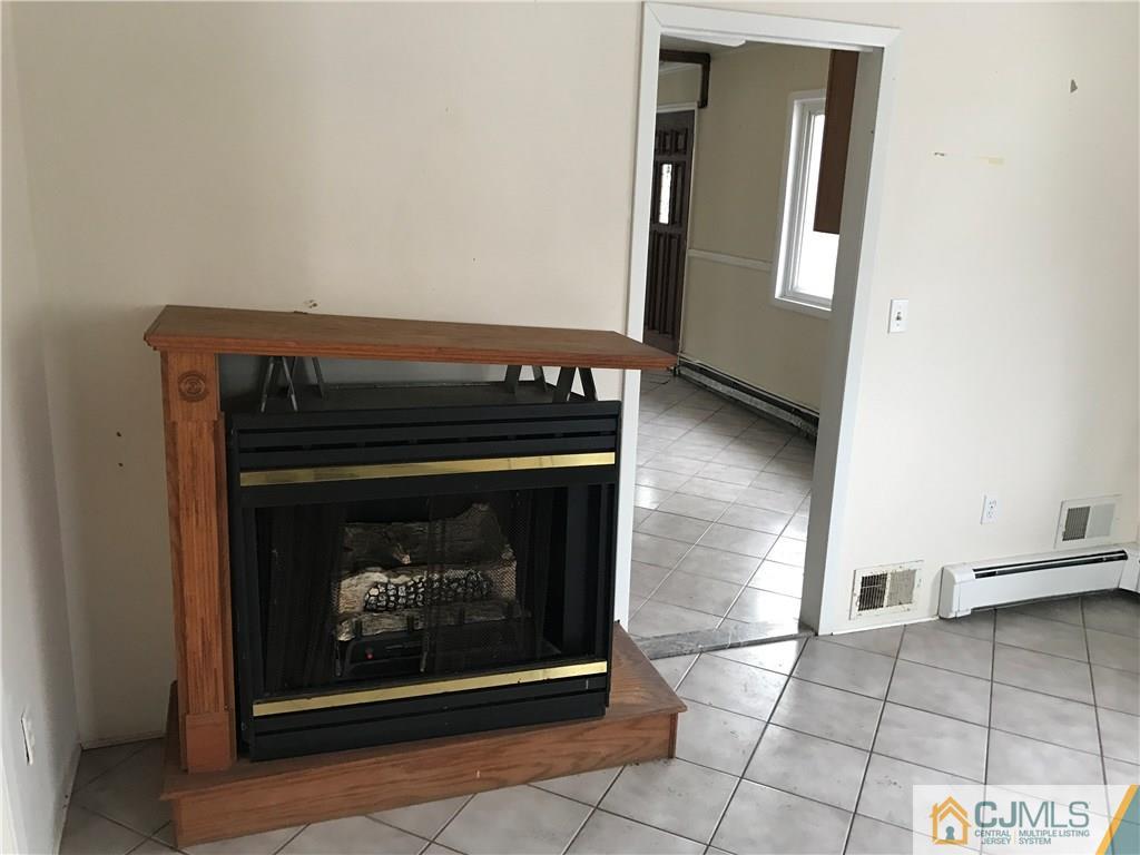 47 Kenmore Road Edison, NJ 08817 - Photo 8 of 14 a stove top oven sitting inside of a kitchen
