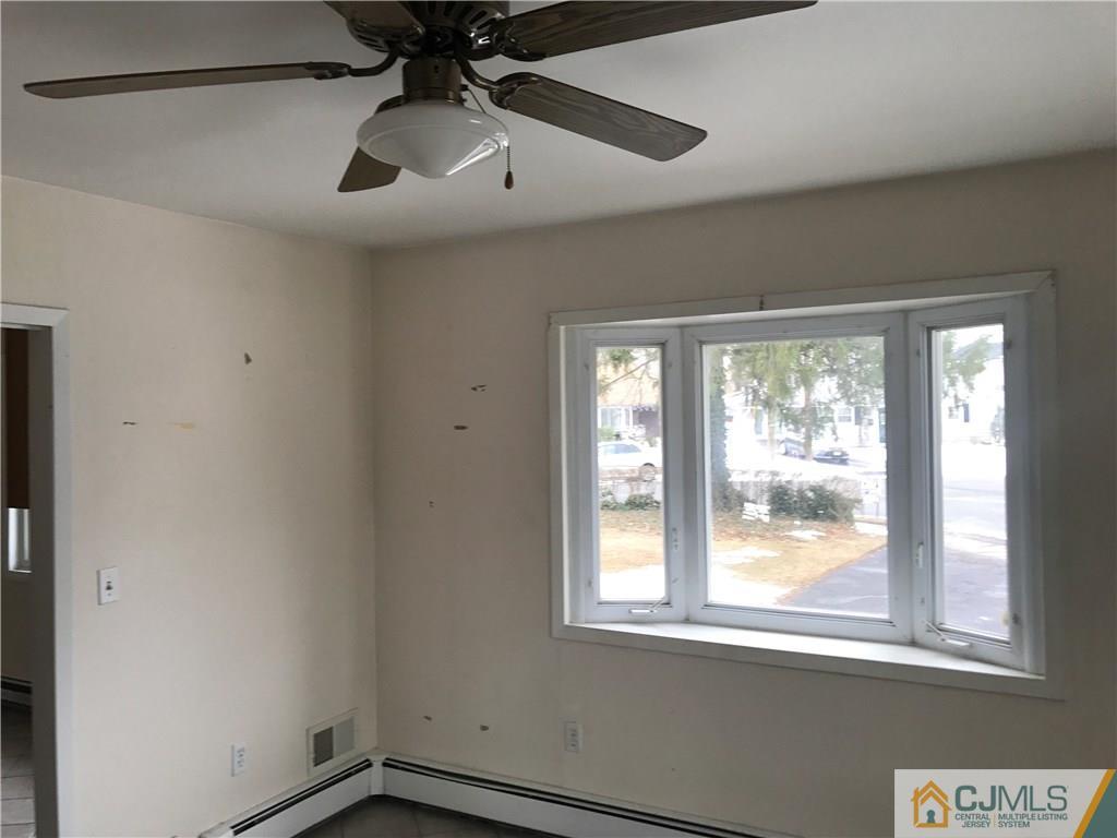 47 Kenmore Road Edison, NJ 08817 - Photo 9 of 14 a view of an empty room with a window