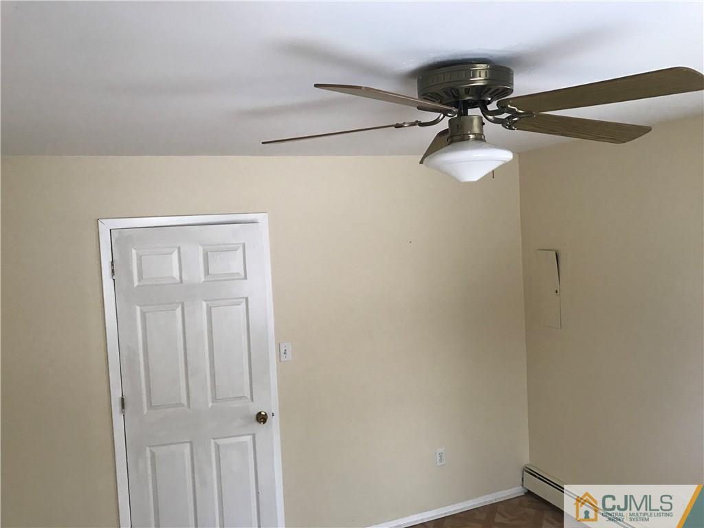 47 Kenmore Road Edison, NJ 08817 - Photo 10 of 14 a view of a light fixture and a fan