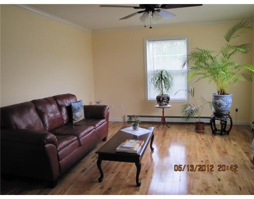 302 Wilson Pond Road North Monmouth, ME 04265 - Photo 4 of 21 Living Room. Gleaming hardwood...