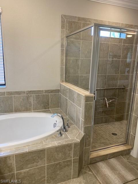 1330 Oceania Drive, Unit 2 Naples, FL 34113 - Photo 15 of 30 a bathroom with a shower and a bathtub