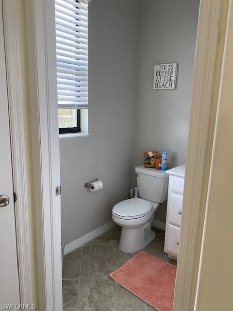 1330 Oceania Drive, Unit 2 Naples, FL 34113 - Photo 19 of 30 a bathroom with a toilet and a sink