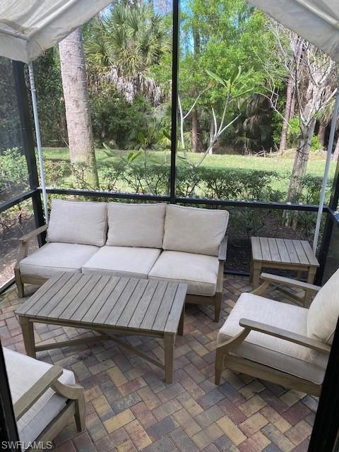 1330 Oceania Drive, Unit 2 Naples, FL 34113 - Photo 28 of 30 a roof deck with couch and outdoor seating