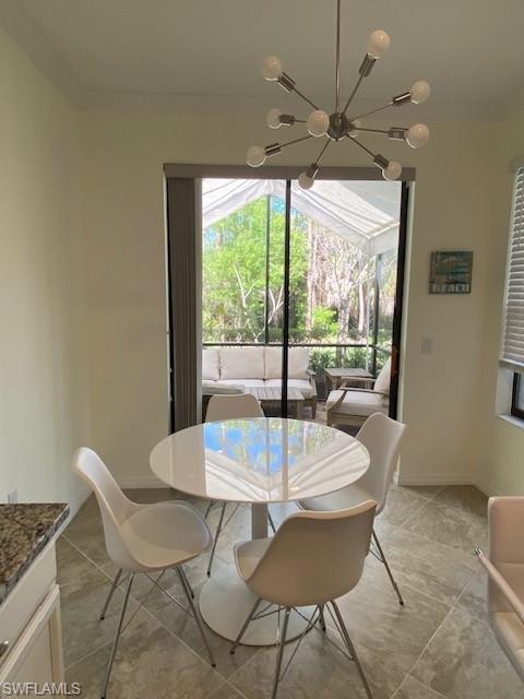 1330 Oceania Drive, Unit 2 Naples, FL 34113 - Photo 5 of 30 a view of a dining room with furniture window and outside view