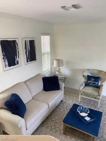 a living room with furniture and a couch
