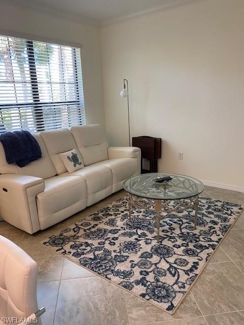1330 Oceania Drive, Unit 2 Naples, FL 34113 - Photo 8 of 30 a living room with a couch and a window