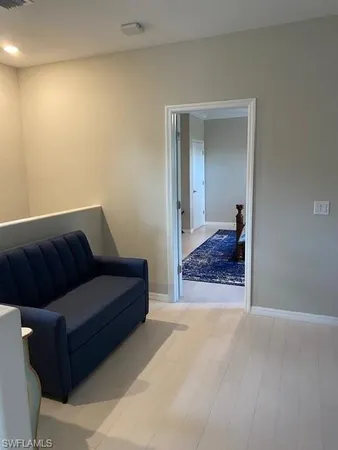 a living room with a couch and dresser