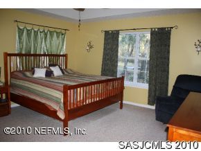 4640 Carter Road St. Augustine, FL 32086 - Photo 5 of 12 a bedroom with furniture and a window