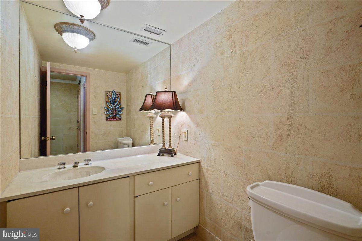 800 25th Street Northwest, Unit 504 Washington, DC 20037 - Photo 27 of 52 Elegant bathroom with warm lighting.