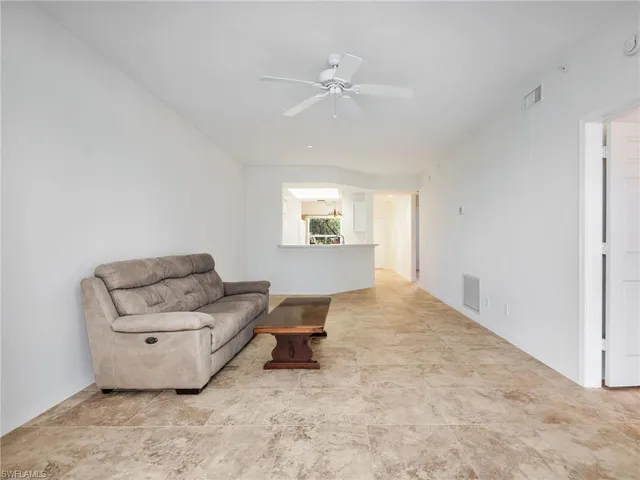 a view of a room with a large window