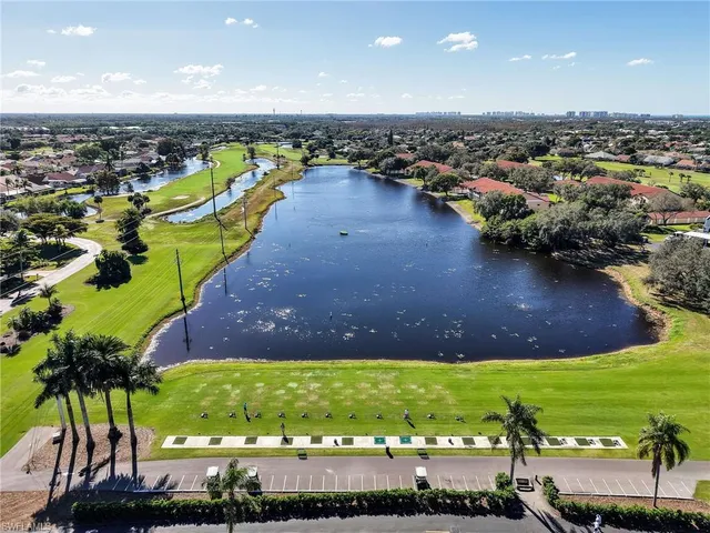 an aerial view of a house with a lake view
