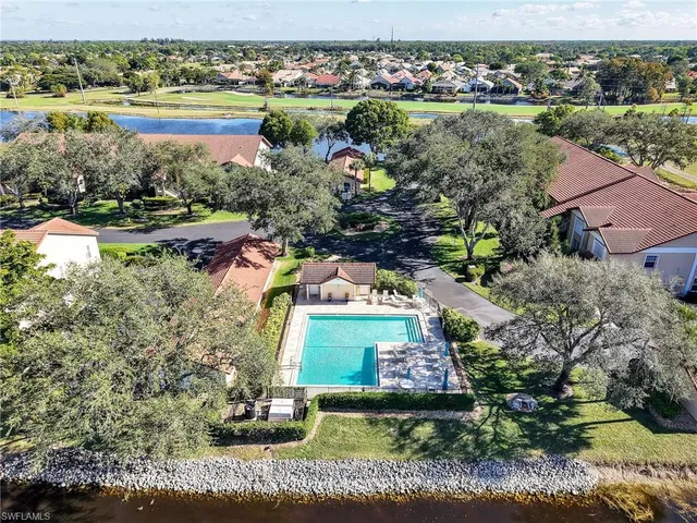an aerial view of residential building with green space