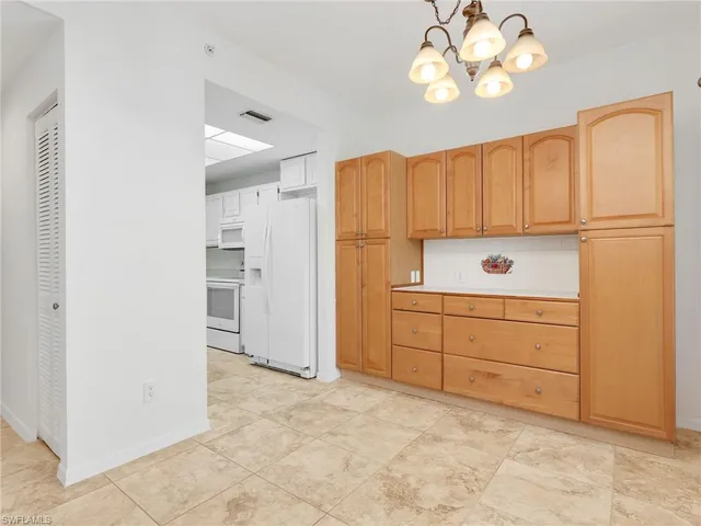 a view of a kitchen with cabinets