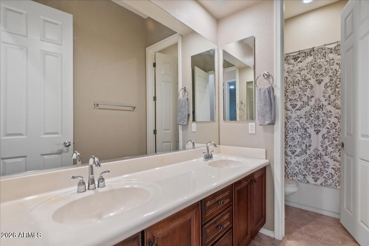 6427 South Magic Court Gilbert, AZ 85298 - Photo 36 of 71 a bathroom with a sink and a mirror
