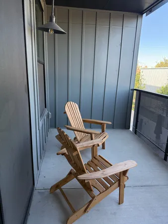 a living room with a furniture and a window
