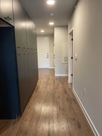 an empty room with wooden floor