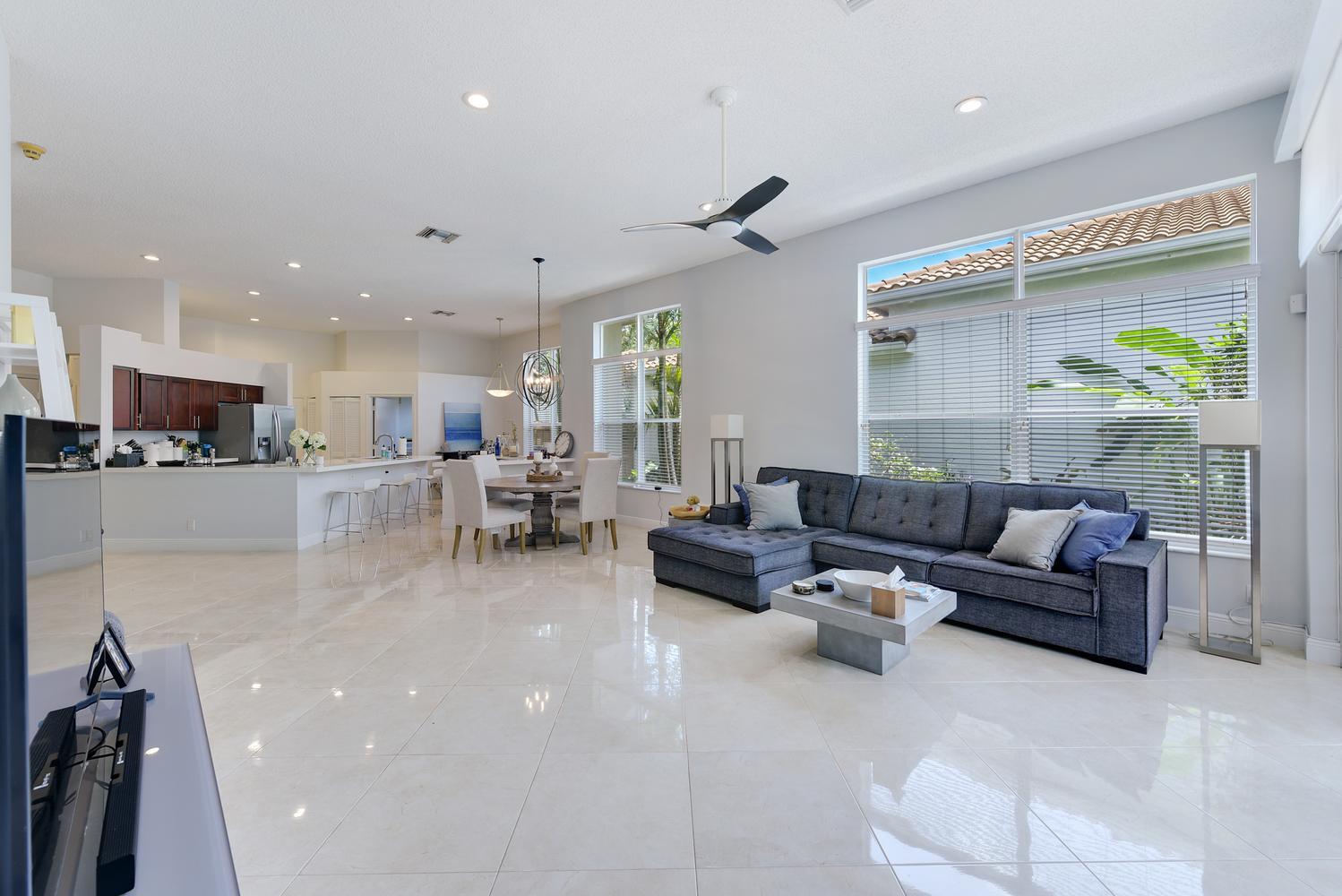 6685 Northwest 24th Terrace Boca Raton, FL 33496 - Photo 11 of 31 a living room with furniture and a large window