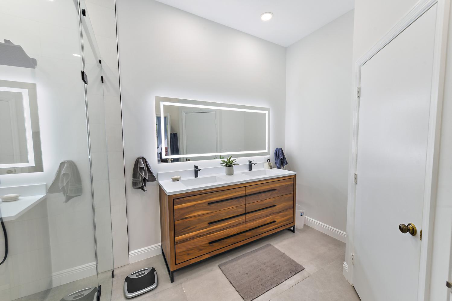 6685 Northwest 24th Terrace Boca Raton, FL 33496 - Photo 14 of 31 a bathroom with a sink and a mirror