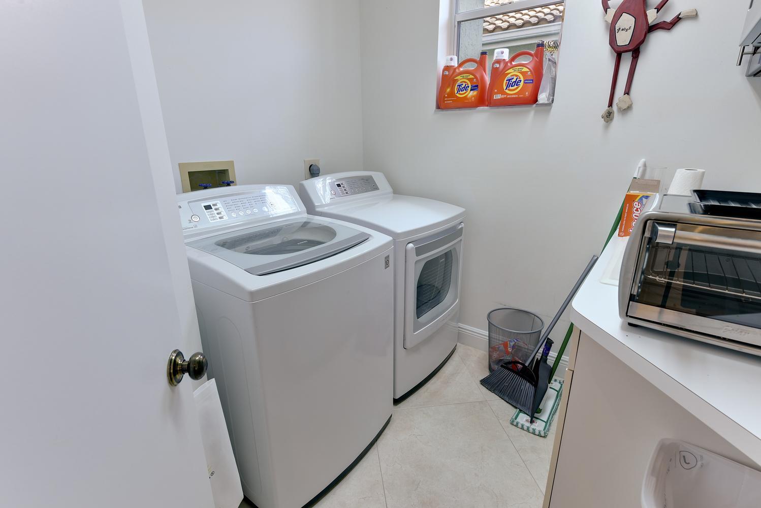 6685 Northwest 24th Terrace Boca Raton, FL 33496 - Photo 22 of 31 a utility room with dryer and washer