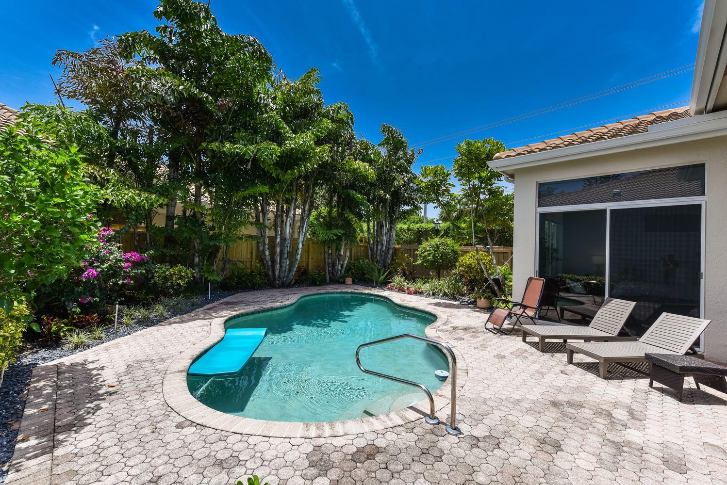 6685 Northwest 24th Terrace Boca Raton, FL 33496 - Photo 27 of 31 a view of a lounge chair in the patio