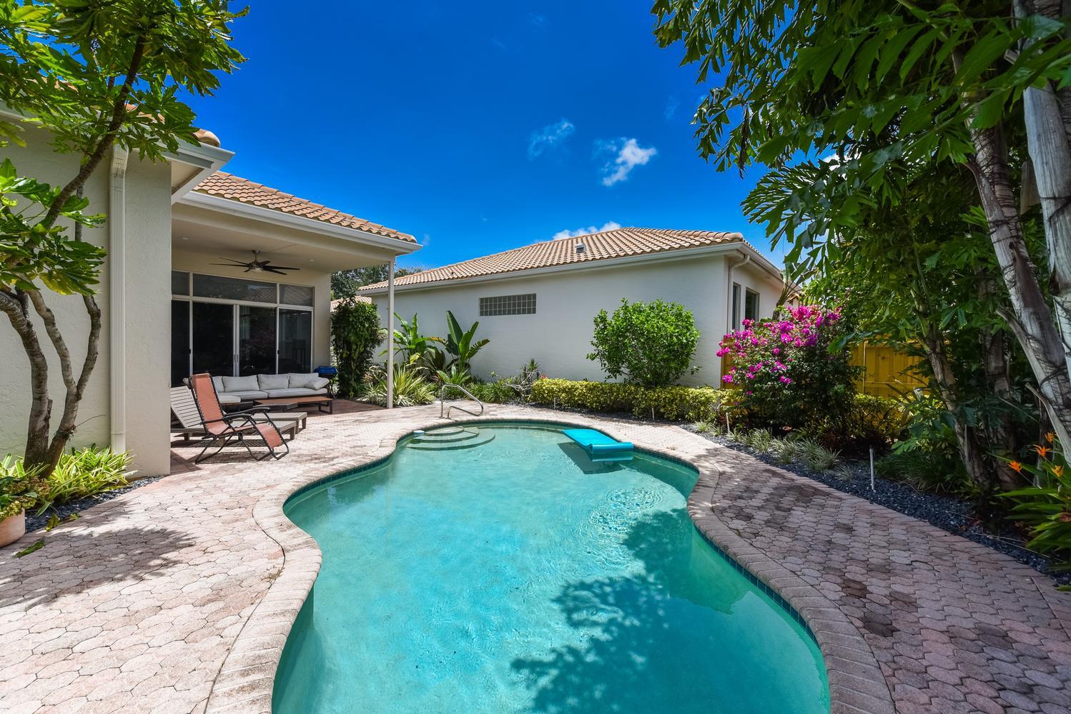 6685 Northwest 24th Terrace Boca Raton, FL 33496 - Photo 28 of 31 a view of a house with swimming pool and sitting area