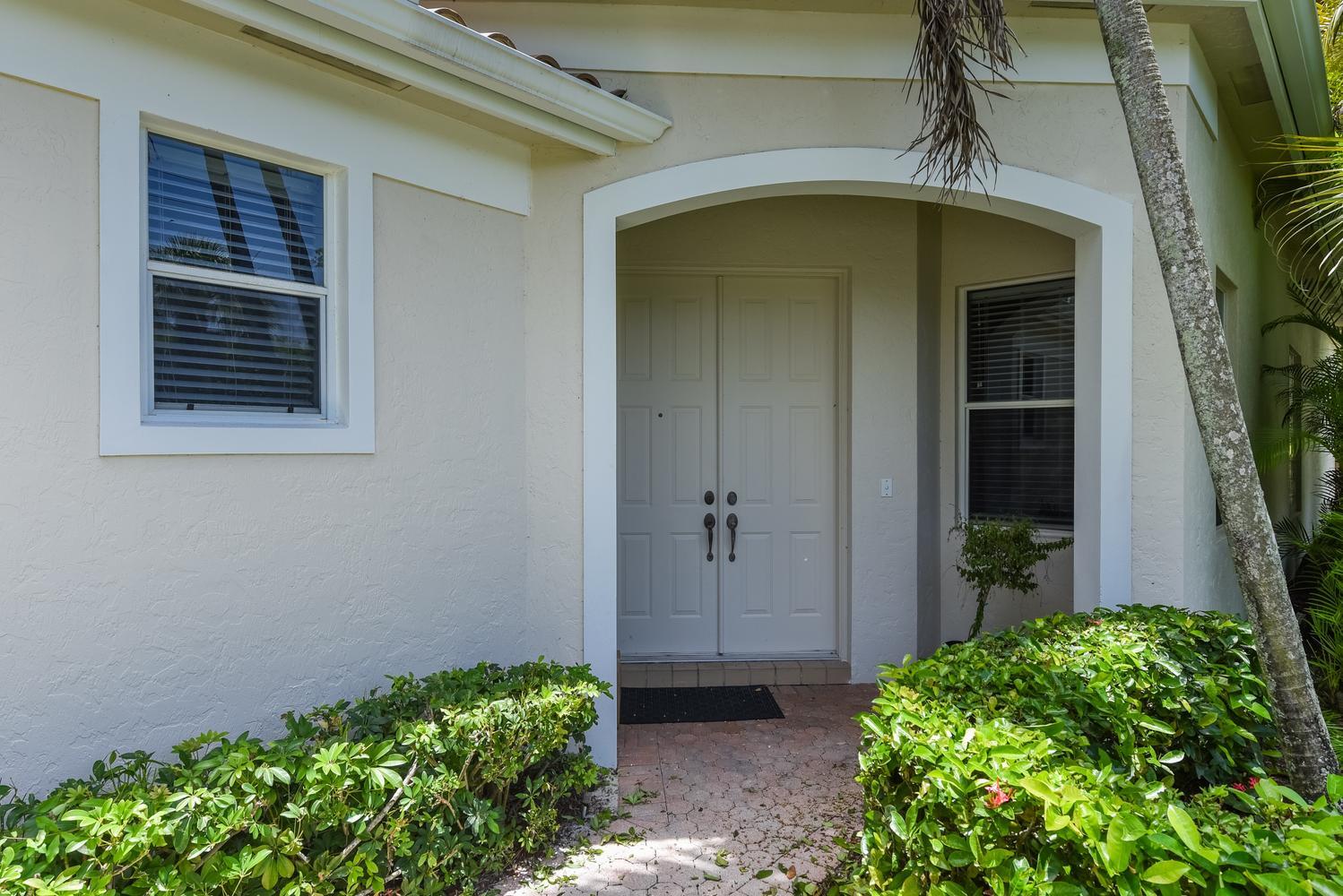 6685 Northwest 24th Terrace Boca Raton, FL 33496 - Photo 3 of 31 a view of a entryway door of the house