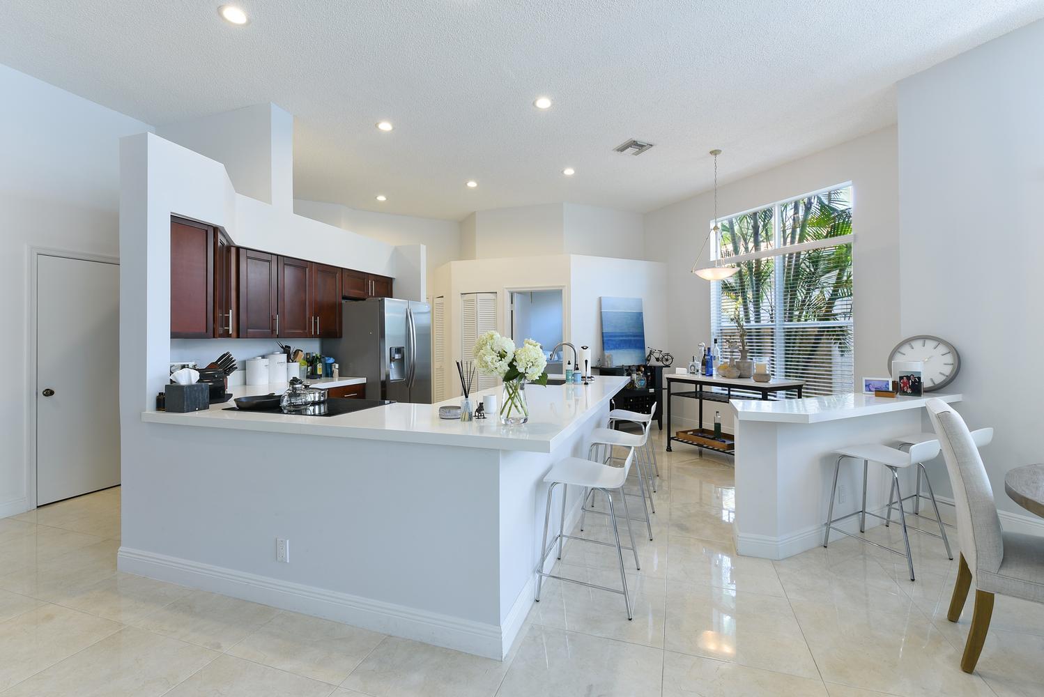 6685 Northwest 24th Terrace Boca Raton, FL 33496 - Photo 5 of 31 a kitchen with counter top space a sink cabinets and appliances