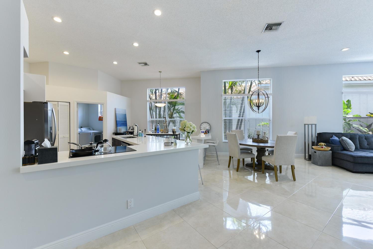 6685 Northwest 24th Terrace Boca Raton, FL 33496 - Photo 6 of 31 a view of a kitchen and dining room