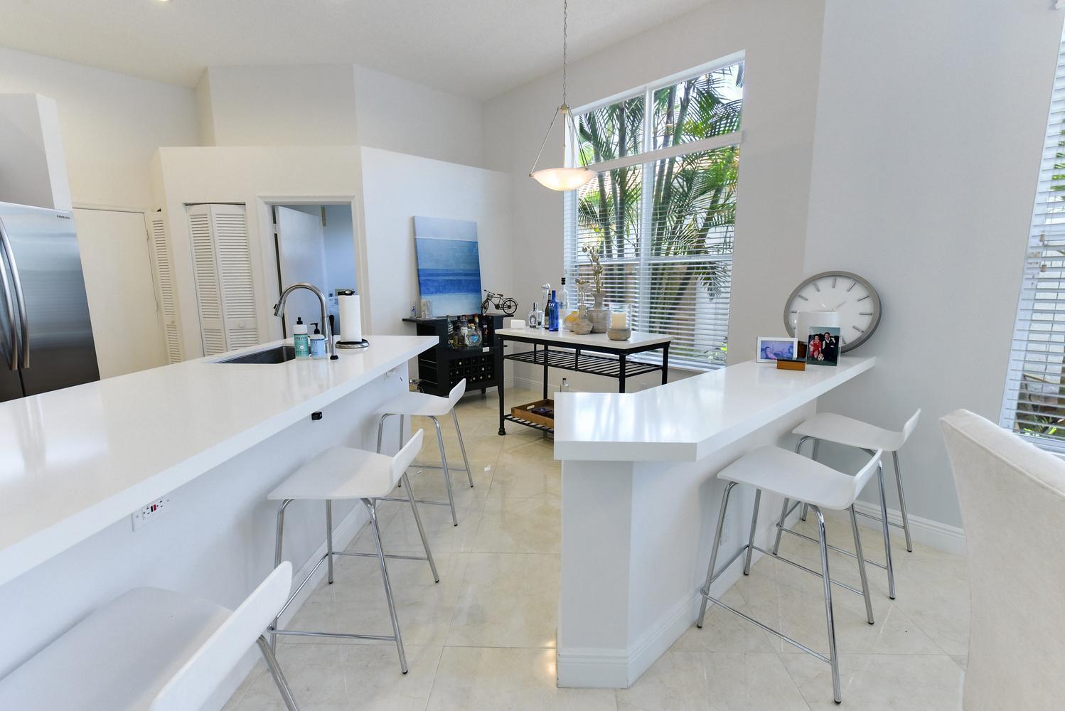 6685 Northwest 24th Terrace Boca Raton, FL 33496 - Photo 7 of 31 a work place with granite countertop furniture and a large window