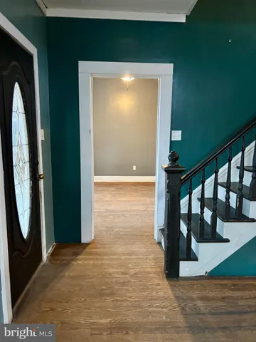 a view of entryway with wooden floor