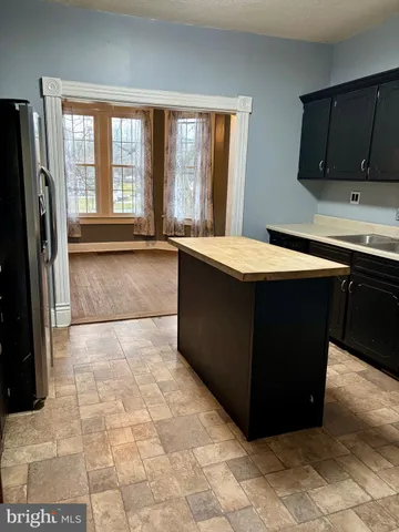 a room with a large window and a counter top space