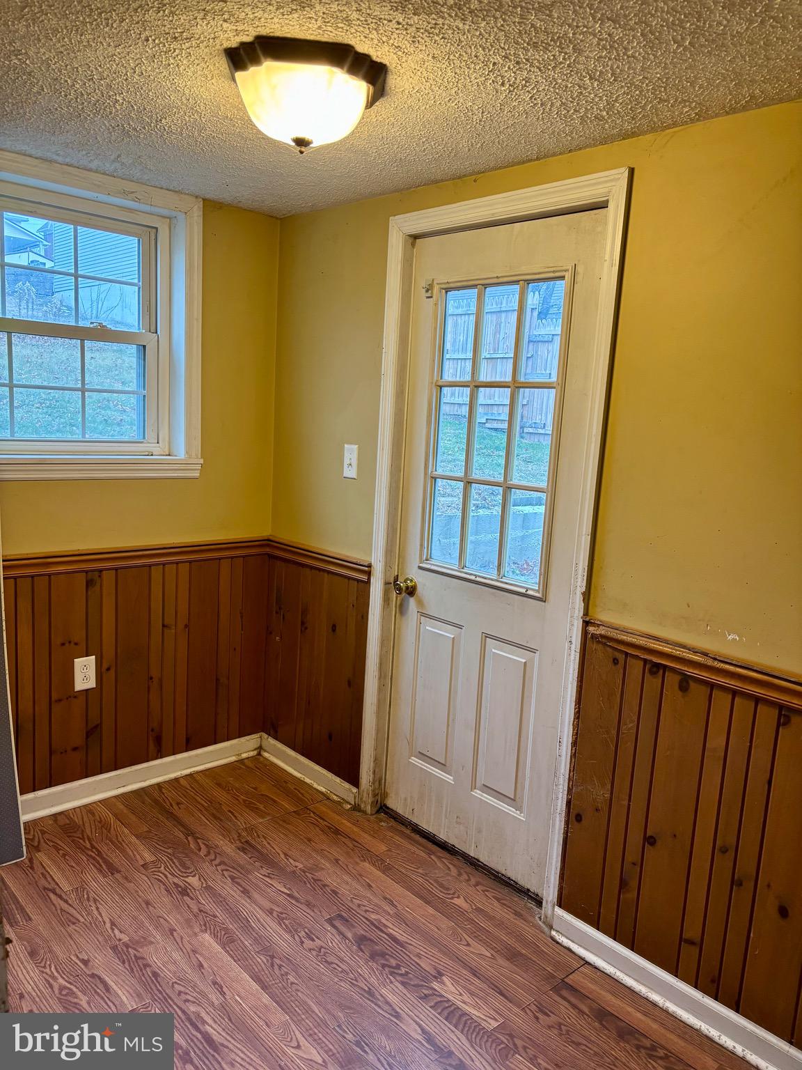 1006 Main Street Saxton, PA 16678 - Photo 24 of 40 wooden floor in an empty room with a window