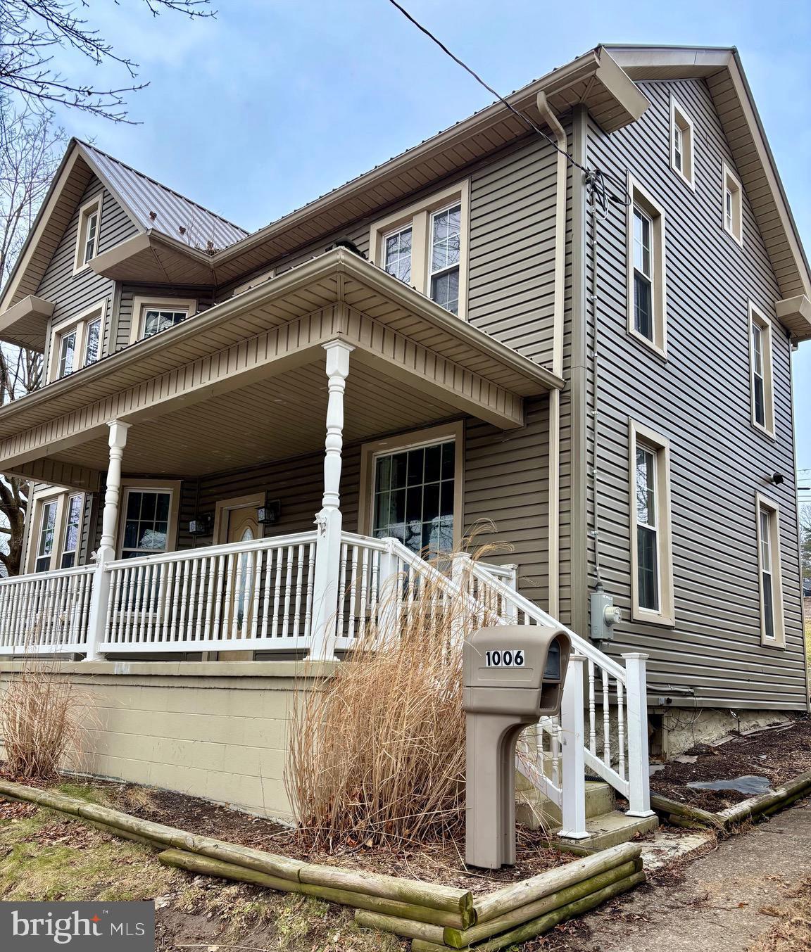 1006 Main Street Saxton, PA 16678 - Photo 3 of 40 a front view of a house with a garden