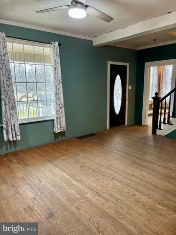 a view of a livingroom with wooden floor