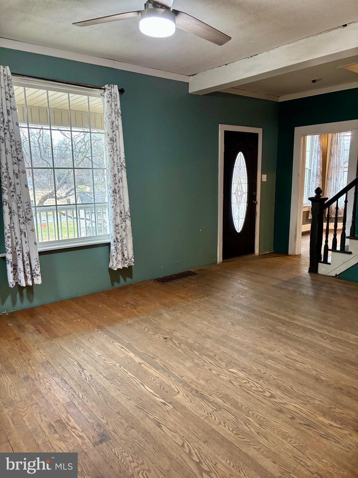 1006 Main Street Saxton, PA 16678 - Photo 8 of 40 a view of a livingroom with wooden floor
