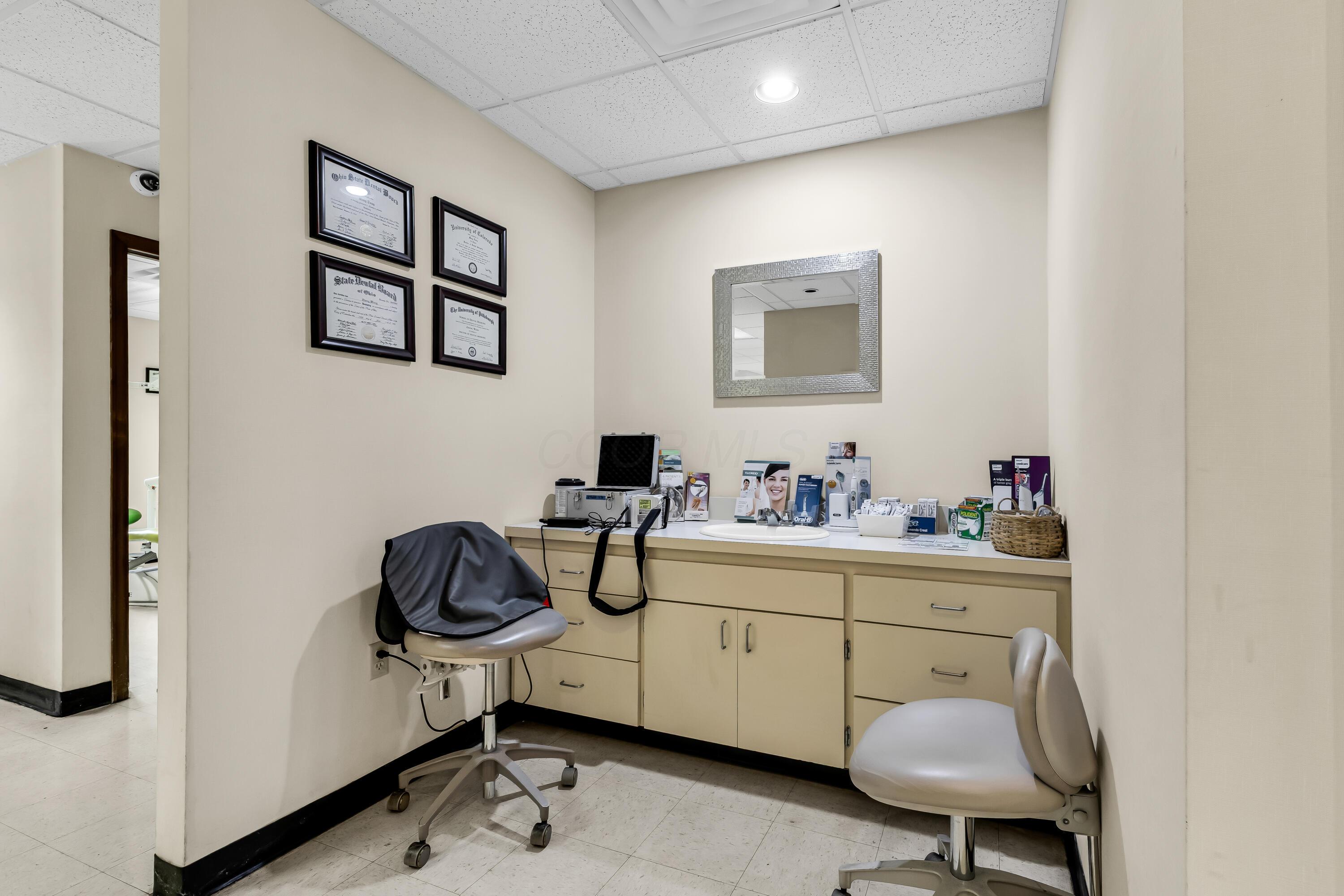 1240 Crescent Heights Road Marion, OH 43302 - Photo 47 of 60 • Neutral vinyl flooring • Ivory painted walls • Acoustic ceiling tiles • Can lighting • Enclosed vanity with single bowl sink & vanity