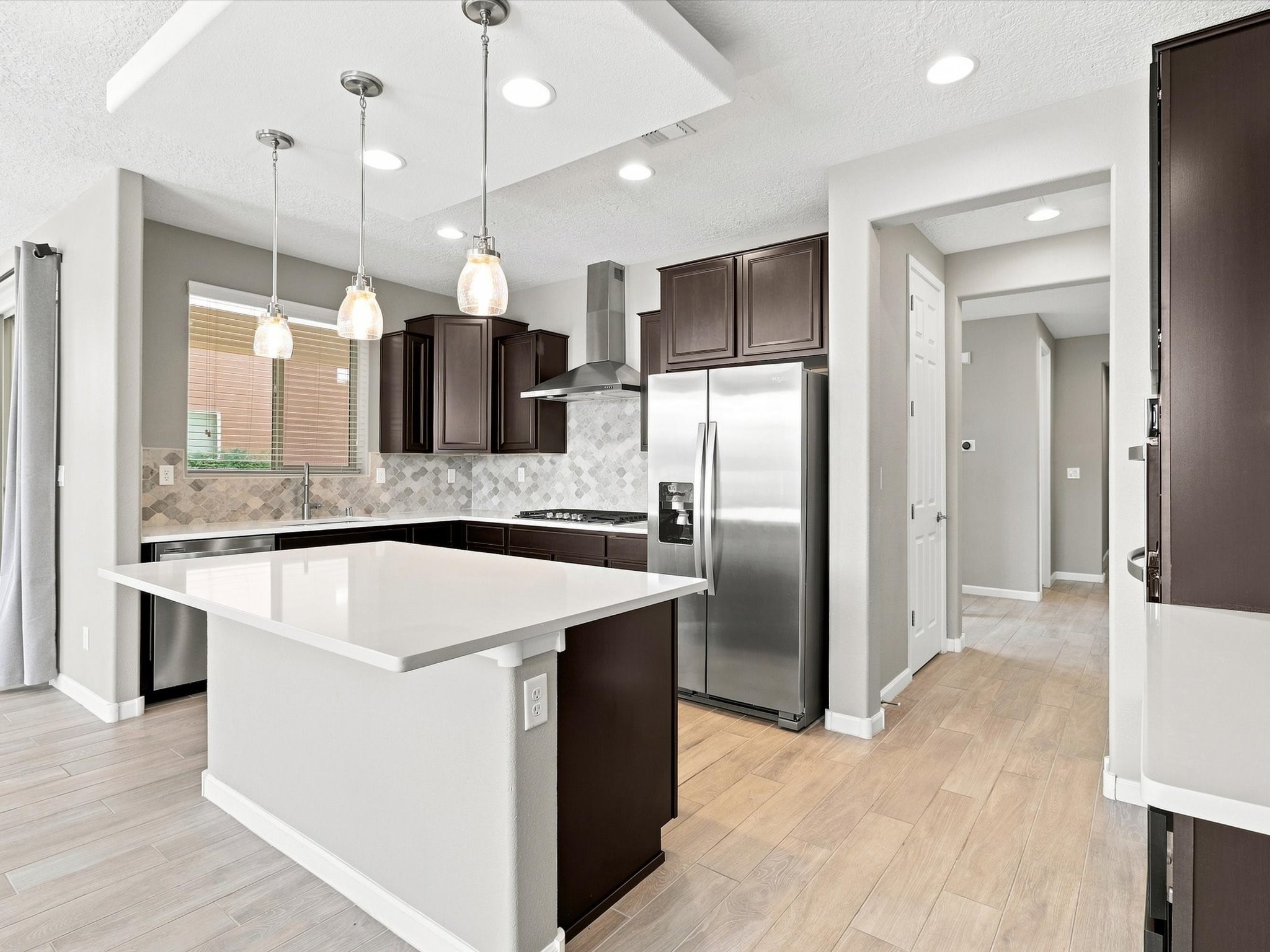 4642 Rail Runner Road Santa Fe, NM 87507 - Photo 18 of 74 Ample cabinetry provides the storage space needed for everyday cooking and entertaining.