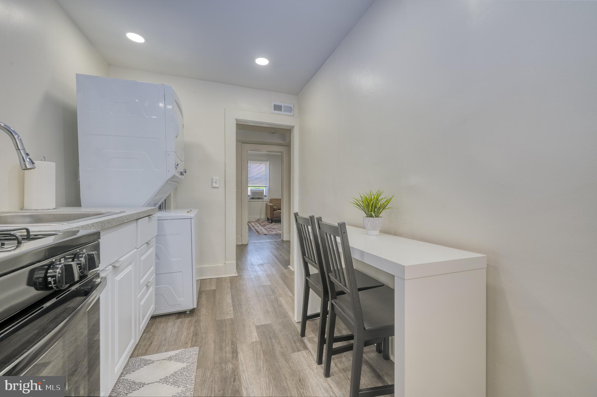 7104 Harford Road Baltimore, MD 21234 - Photo 11 of 37 a kitchen with furniture and a stove