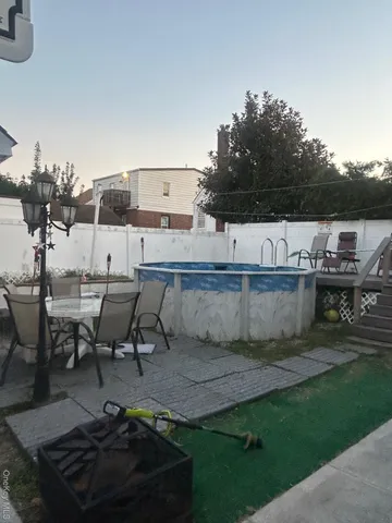 a view of a swimming pool with chairs