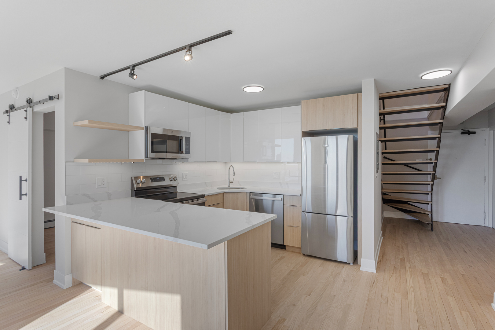 6166 North Sheridan Road, Unit 6K Chicago, IL 60660 - Photo 4 of 21 a kitchen with stainless steel appliances a refrigerator and a stove top oven