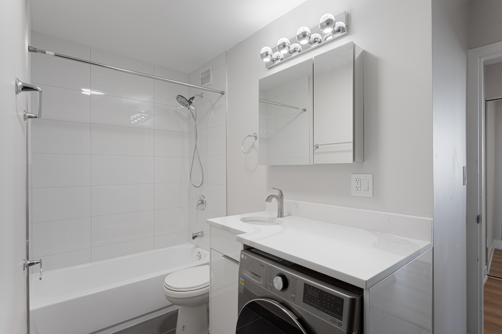 6166 North Sheridan Road, Unit 6K Chicago, IL 60660 - Photo 10 of 21 a bathroom with a sink a toilet and a shower