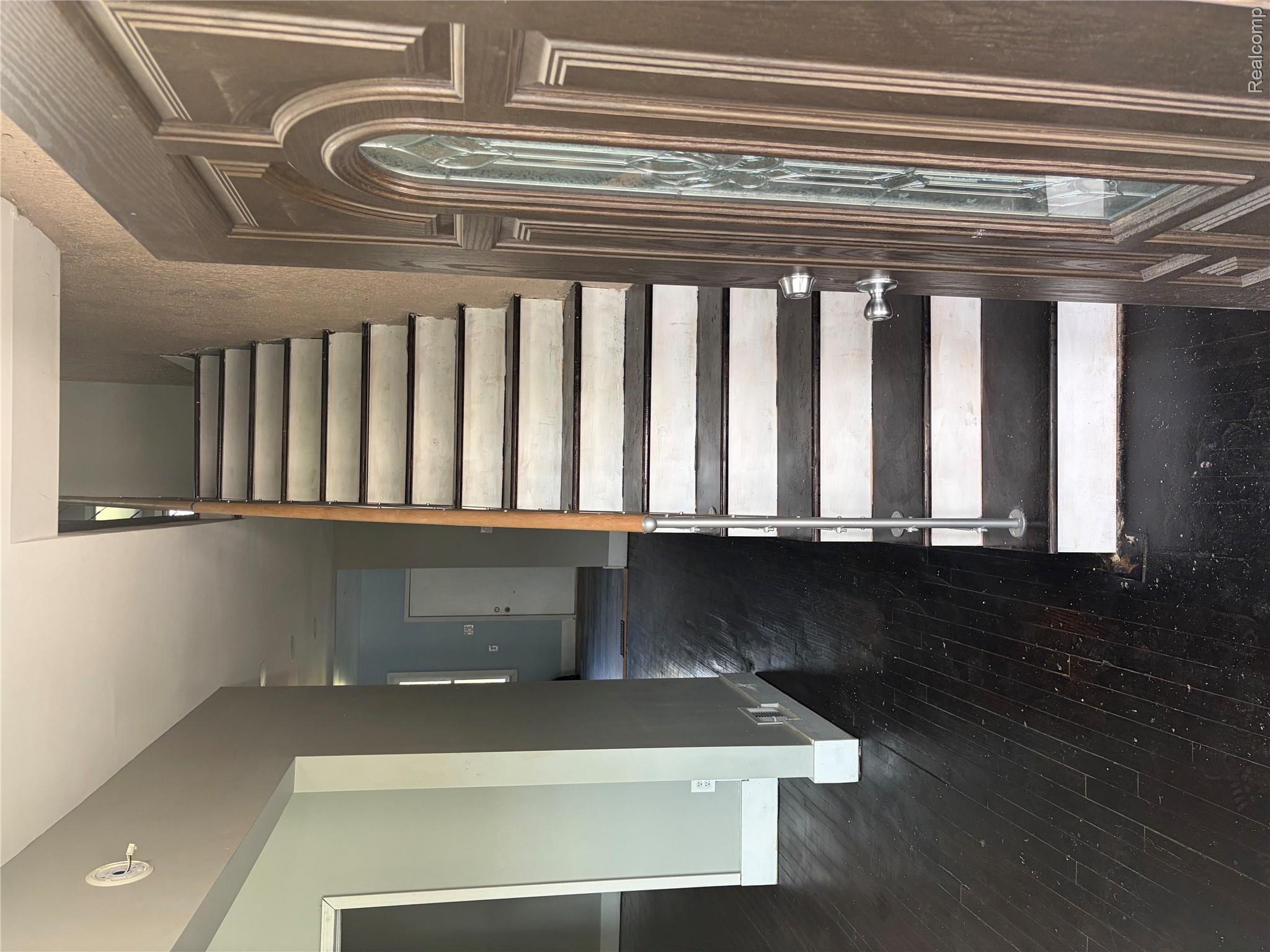 2420 Field Street Detroit, MI 48214 - Photo 2 of 15 Stairway with baseboards and wood-type flooring