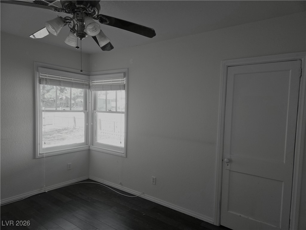 667 C Boulder City, NV 89005 - Photo 6 of 6 Spare room featuring dark wood-style floors and a ceiling fan