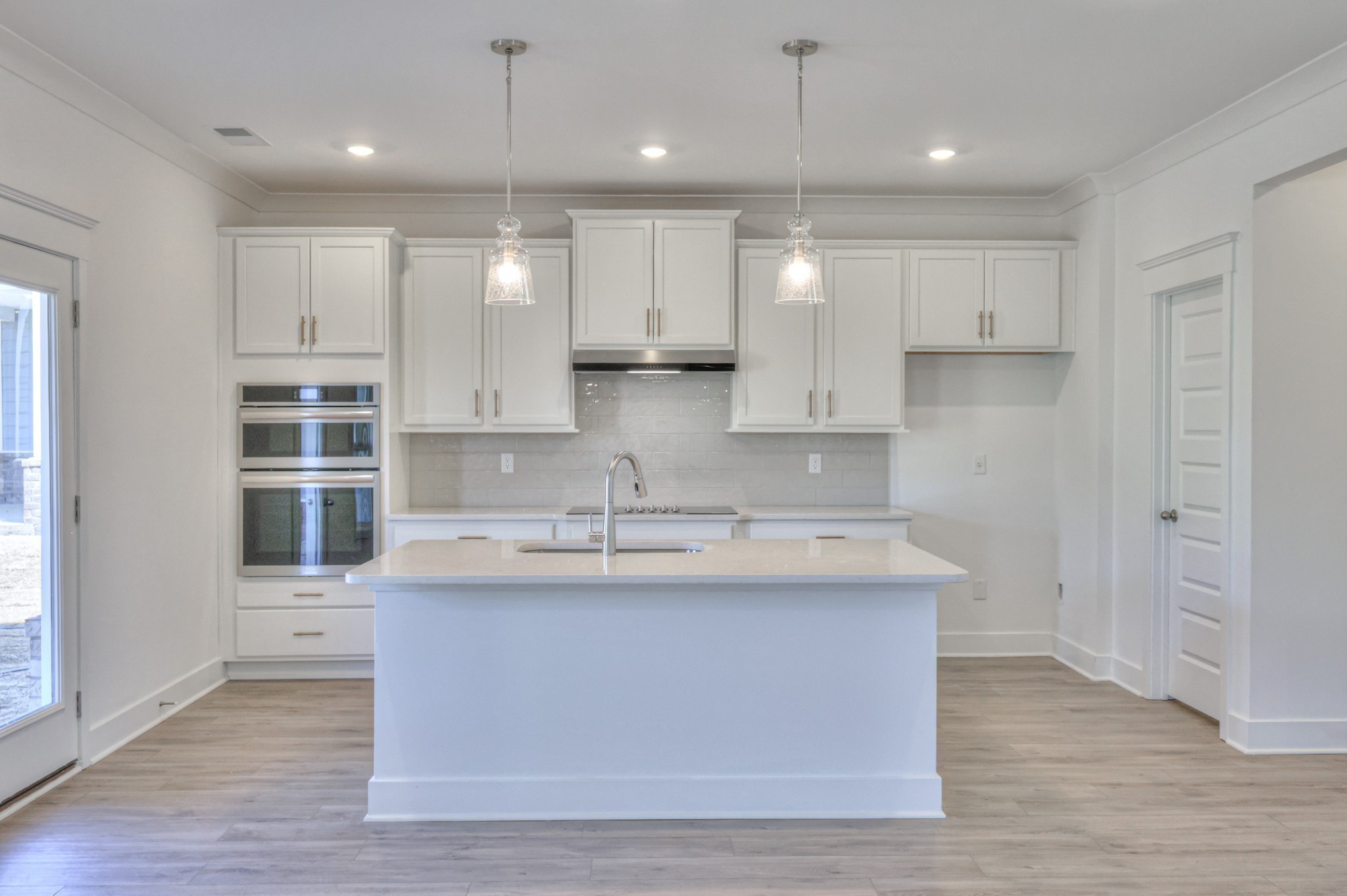 2584 Bluestem Road Columbia, TN 38401 - Photo 12 of 35 a large kitchen with kitchen island a sink stainless steel appliances and cabinets